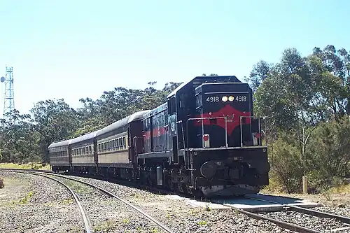 A heritage train stops at Summit Tank platform