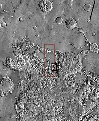 THEMIS image of wide view of following HiRISE images. Black box shows location of HiRISE images. Image is part of the Aureum Chaos. Click on image for details.
