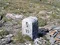 Border stone at Passo San Giacomo between Val Formazza in Italy and Val Bedretto&nbsp;[it] in Switzerland