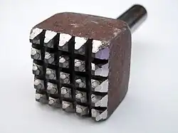 A bush hammer chisel for pneumatic hammers