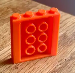 A custom 3D print of a brick system expansion card for Framework Laptop.