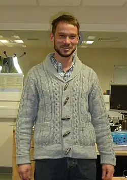 Image 112Man wearing shawl collar cardigan and hipster-inspired beard, 2011. (from 2010s in fashion)