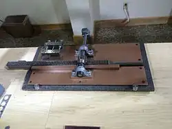 A photograph of a hand-cranked machine