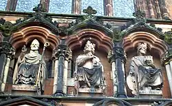 St Chad (left), alongside Mercian kings Peada and Wulfhere, as portrayed in 19th-century sculpture above the western entrance to Lichfield Cathedral.