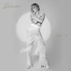 Black-and-white photograph of Carly Rae Jepsen, topless in white fringe pants