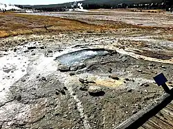 Ear Spring in September 2018 showing areas where bacterial mats had been killed (compared to image of 2013) and rocks spouted out of the spring after a rare eruption on September 15, 2018