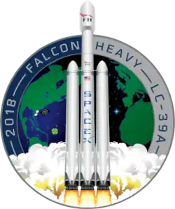 Artistic depiction of a Falcon heavy rocket launching from the Earth, represented in the background by a circular patch.