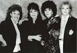 A black-and-white promotional image of The Forester Sisters, showing all four members of the group