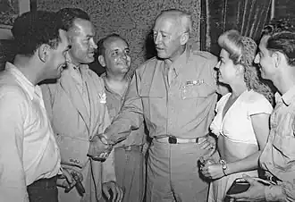 (Left to Right) Writer Hal Block, Hope, writer/actor Barney Dean, General George Patton, singer Frances Langford, and musician Tony Romano in Sicily on August 21, 1943