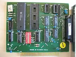 An IBM PC serial card with a 25-pin connector (obsolete 8-bit ISA card)