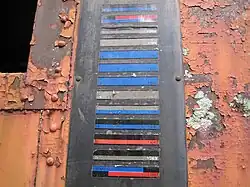 A KarTrak railroad Automatic Equipment Identification label on a caboose in Florida