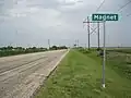 Magnet sign and broadcasting tower are on Highway 60.