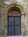 Details on the side of a door of the church