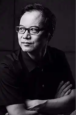 Black and white photographic portrait of Wang Chunchen