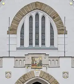 Detail of the facade: gothic and secessionist elements coexist.