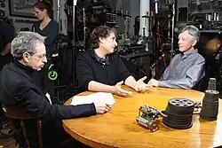 Robert Lawrence Kuhn, Peter Getzels and J. L. Schellenberg on the set of Closer to Truth