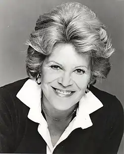Black and white portrait photograph of Roberts in 1976. She is smiling and looking into the camera.