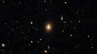 "Seeing Quintuple" a phenomenon known as gravitational lensing.
