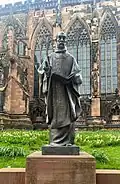 A sculpture of St Chad unveiled[27] in 2021 outside Lichfield Cathedral.