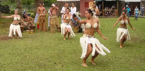 Polynesian dancing with feather costumes is on the tourist itinerary.