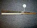 An iron Japanese tessen fan with wood ribs