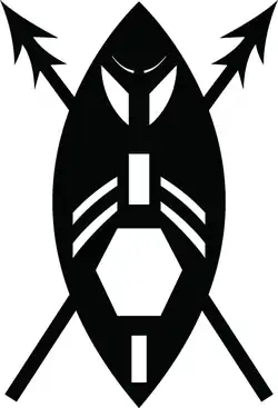 A black and white image of a stylised version of an African shield as a warrior's face with two crossed spears. The shield is encompassed by two circle arcs with white geometric shapes as cut-outs: rectangle at bottom, a larger hexagon (in the position of the mouth), another rectangle (in position of the nose) with two pairs of curved strips (as moustaches), two larger curved sections (in position of the eyes) and two small curved strips (as eyebrows). The spear heads are double pointed.