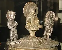 The Kushan Kanishka casket of 127, with (left to right) Brahma, the Buddha and Indra