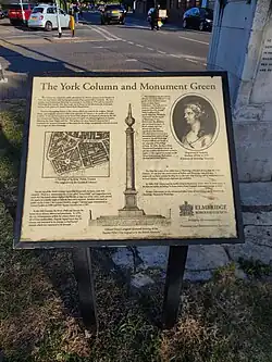 The sign explaining the history of the column.